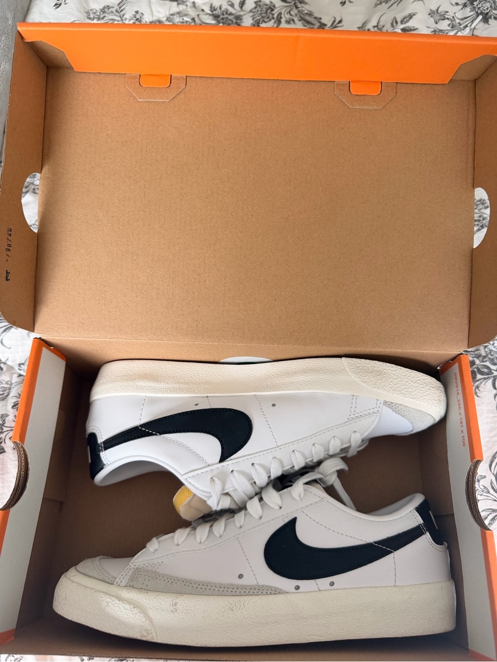 Nike White Low-Top Sneakers with Black Swoosh